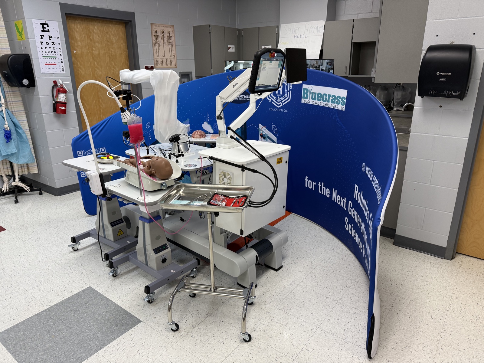 CARE healthcare robotics education system with collaborative robot and healthcare simulation equipment